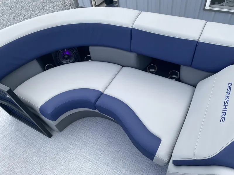 Slide: The Image of Luxurious seating on 2025 Berkshire 23E STS boat with blue and white upholstery. - 3