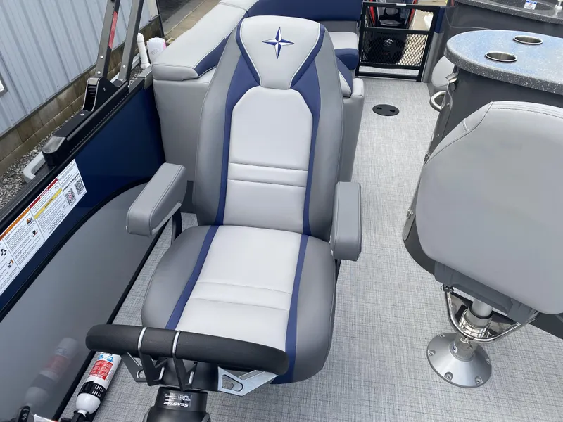 Slide: The Image of 2025 Berkshire 23E STS boat interior with comfortable seating and modern design. - 6