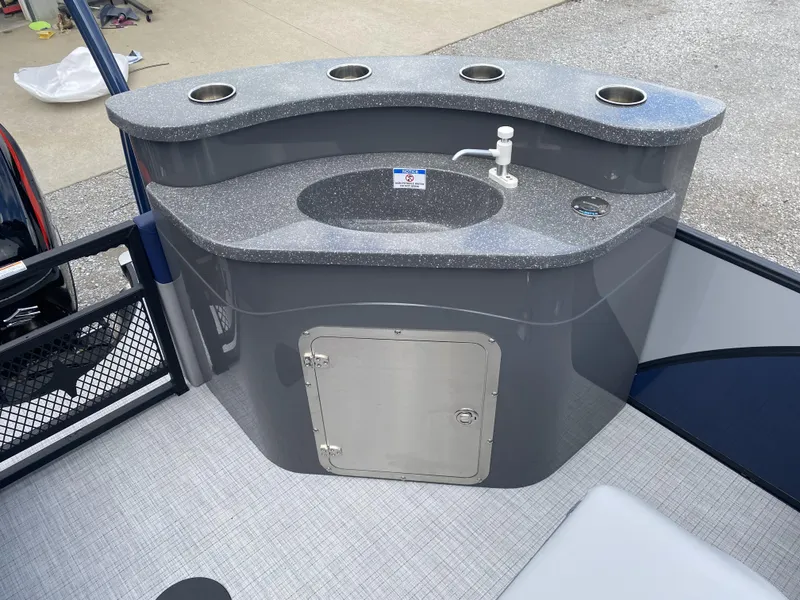 Slide: The Image of 2025 Berkshire 23E STS boat sink with countertop and storage compartment. - 7
