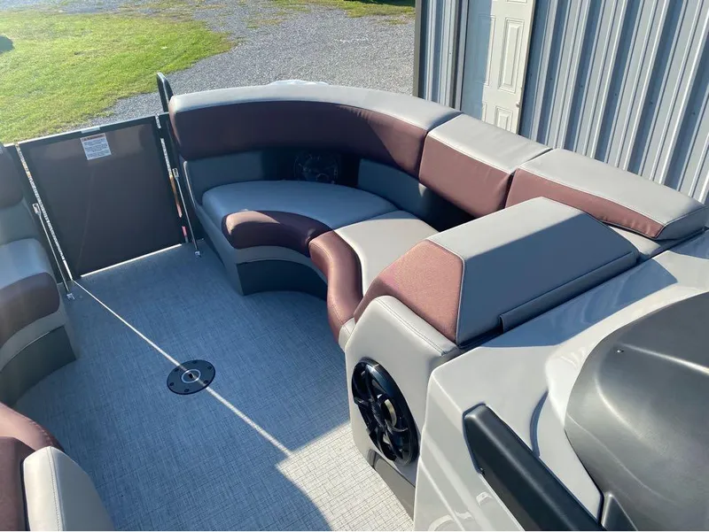 Slide: The Image of 2025 Berkshire 23UL STS pontoon boat interior with plush seating and modern design. - 13