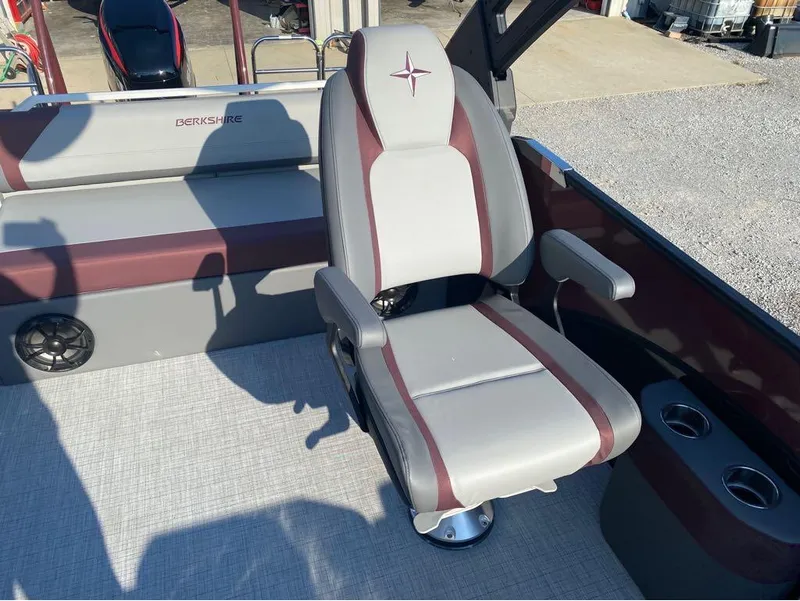 Slide: The Image of Captain's chair on a 2025 Berkshire 23UL STS pontoon boat, featuring stylish upholstery. - 19
