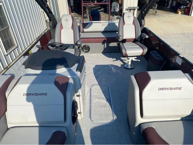 Slide: The Image of 2025 Berkshire 23UL STS boat interior with plush seating and modern design. - 22