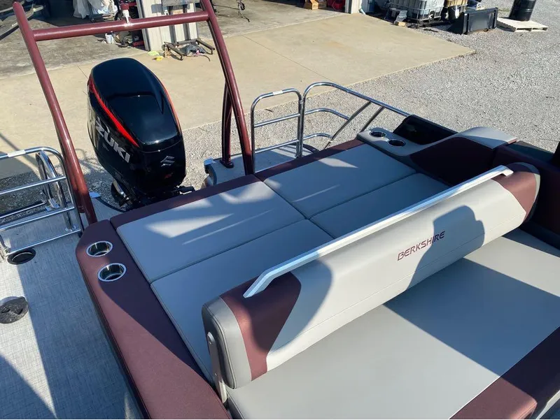Slide: The Image of 2025 Berkshire 23UL STS pontoon boat with Suzuki outboard motor and comfortable seating. - 9