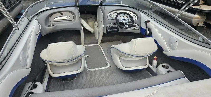 Slide: The Image of 2010 Ebbtide 202 SE Bow Rider interior with seating and dashboard. - 10