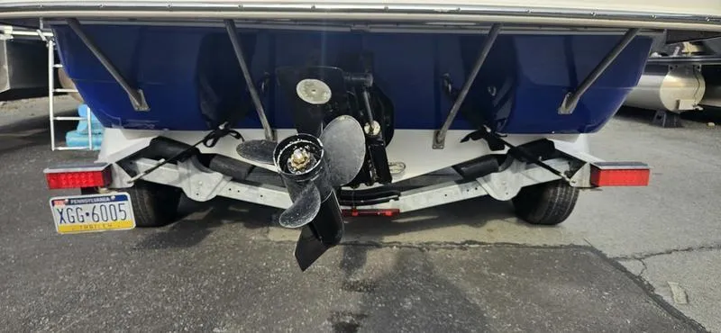 Slide: The Image of Rear view of a 2010 Ebbtide 202 SE Bow Rider boat on a trailer. - 3