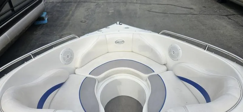 Slide: The Image of 2010 Ebbtide 202 SE Bow Rider boat with spacious seating and sleek design. - 9