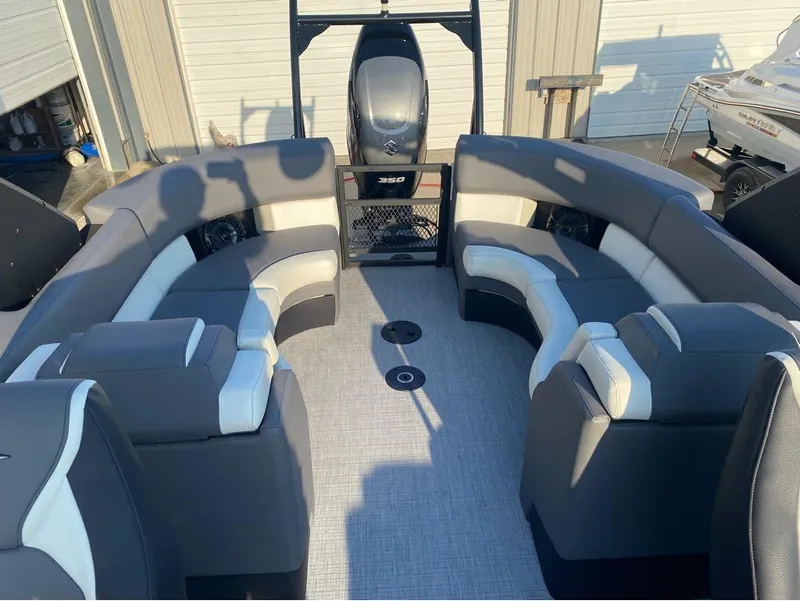 Slide: The Image of 2025 Berkshire 25RFX STS pontoon boat interior with gray and white seating. - 18