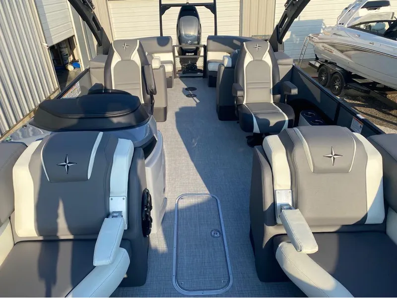 Slide: The Image of 2025 Berkshire 25RFX STS pontoon boat interior with luxurious seating and modern design. - 6