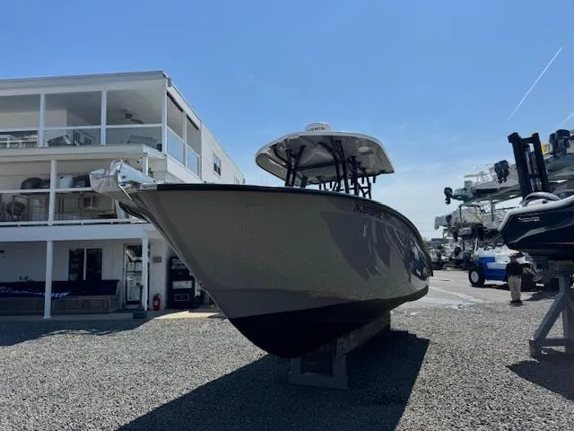 Slide: The Image of 2022 Cape Horn 27 XS boat displayed outdoors near a building. - 13