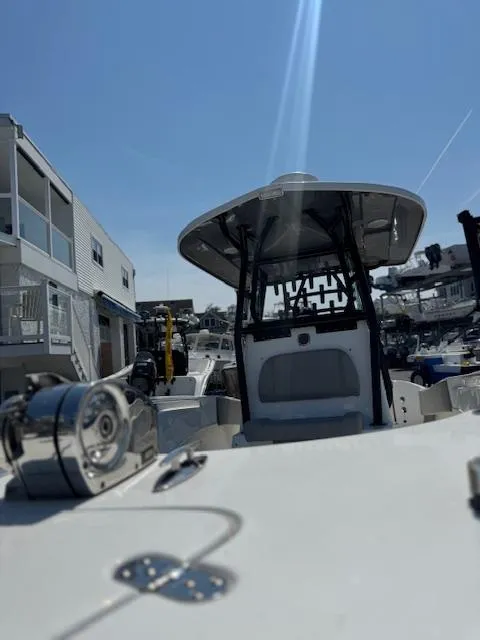 Slide: The Image of 2022 Cape Horn 27 XS boat docked, showcasing sleek design and modern features. - 15