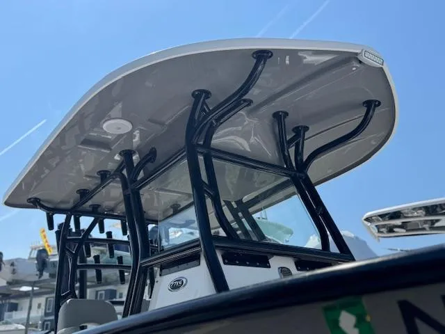 Slide: The Image of 2022 Cape Horn 27 XS boat with T-top and sleek design under clear blue sky. - 16