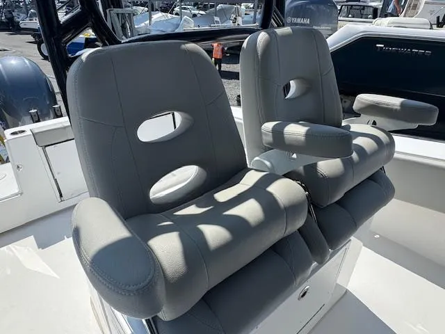 Slide: The Image of 2022 Cape Horn 27 XS boat seats with gray upholstery and armrests. - 3