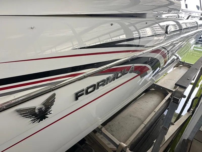Slide: The Image of 2008 Formula 353 FASTech boat with sleek design and bold graphics. - 12