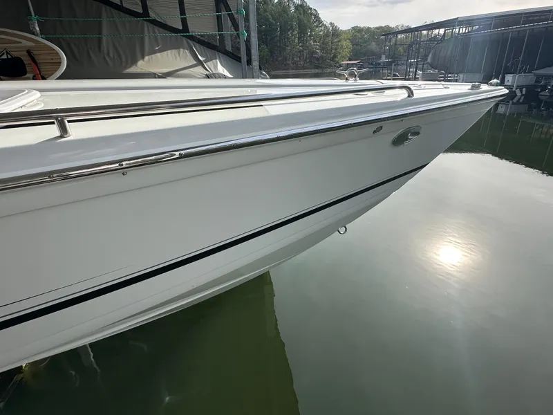 Slide: The Image of 2008 Formula 353 FASTech boat docked, reflecting on calm water. - 16