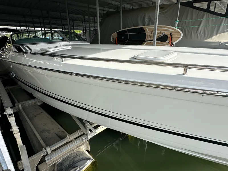 Slide: The Image of 2008 Formula 353 FASTech boat docked in a covered marina. - 17