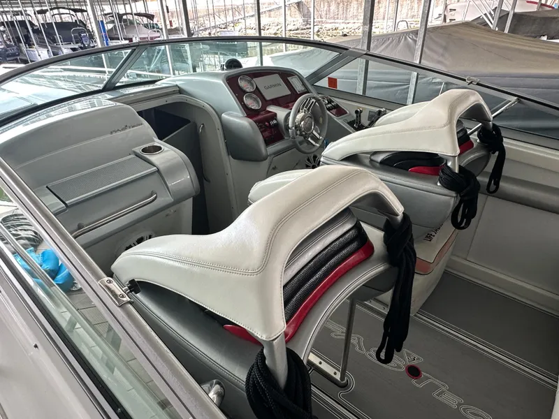Slide: The Image of 2008 Formula 353 FASTech boat interior with white seating and modern dashboard. - 21