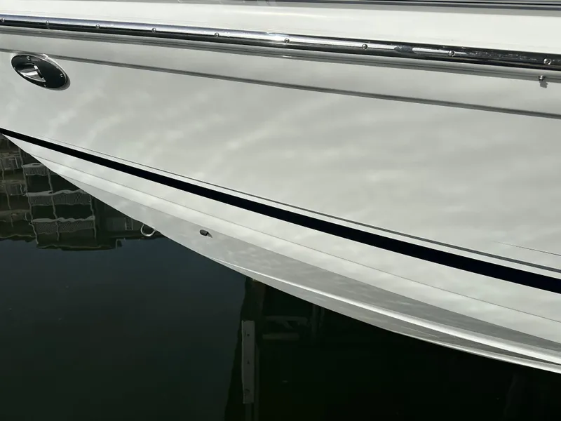 Slide: The Image of 2008 Formula 353 FASTech boat hull with sleek white finish and chrome detailing. - 23