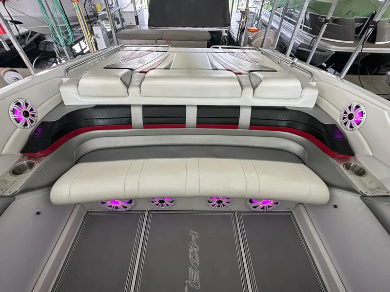 Slide: The Image of 2008 Formula 353 FASTech boat interior with plush seating and purple LED speakers. - 30