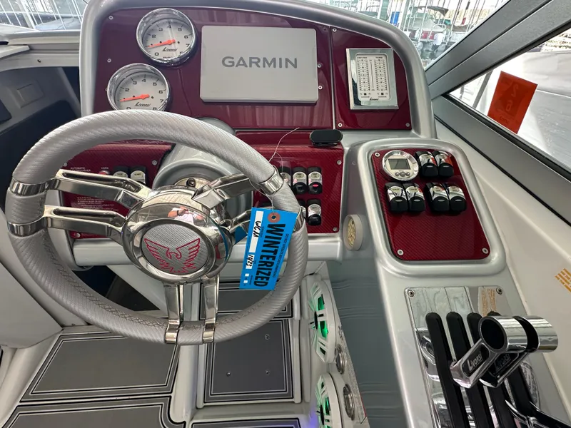 Slide: The Image of 2008 Formula 353 FASTech boat dashboard with Garmin navigation and sleek controls. - 31