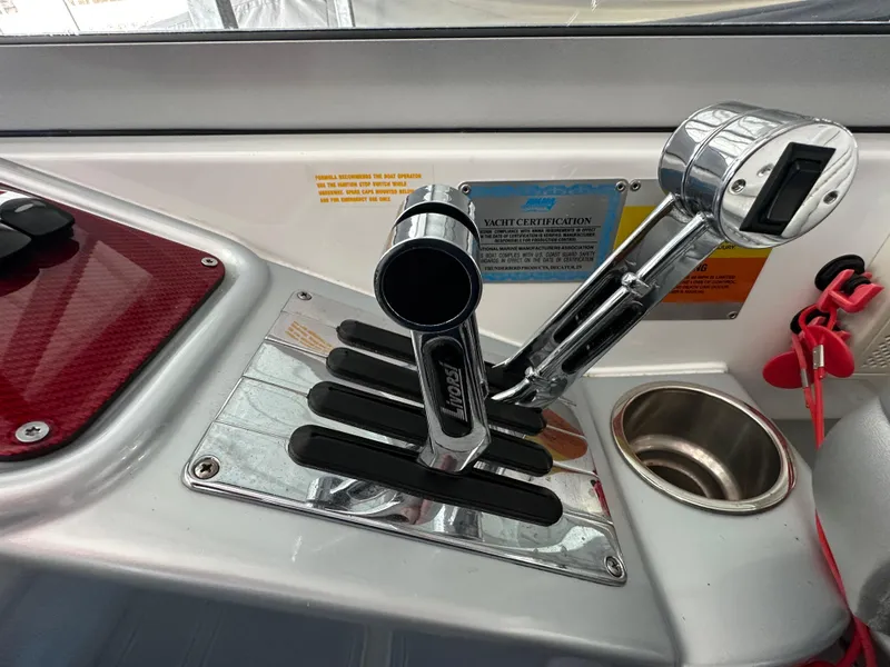 Slide: The Image of Throttle controls of a 2008 Formula 353 FASTech boat cockpit. - 36