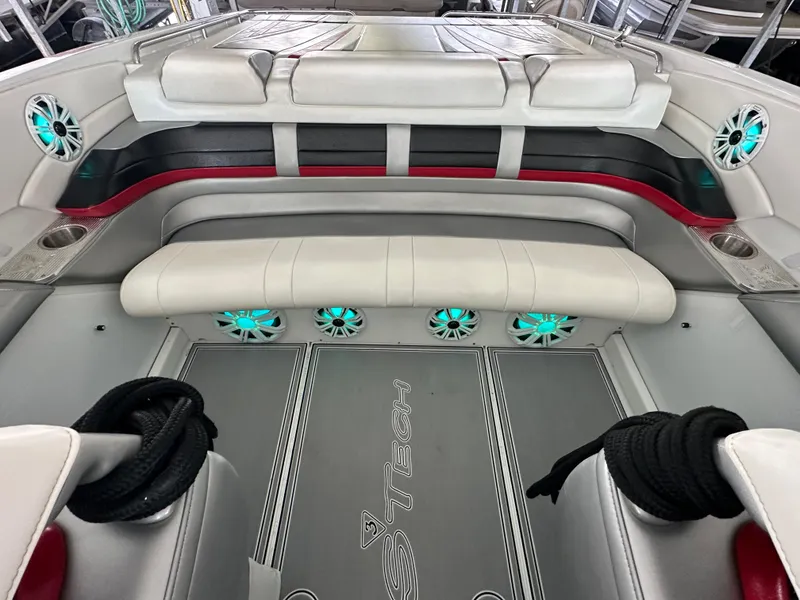 Slide: The Image of 2008 Formula 353 FASTech boat interior with white seating and teal-lit speakers. - 37