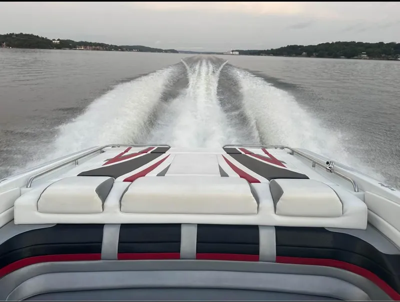 Slide: The Image of 2008 Formula 353 FASTech boat cruising on a lake, leaving a wake behind. - 4