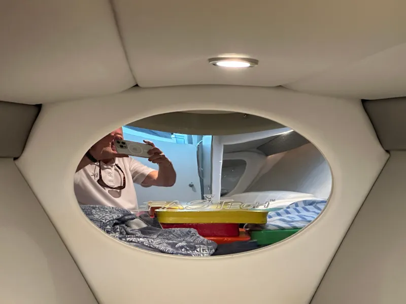 Slide: The Image of Interior view of a 2008 Formula 353 FASTech boat cabin with a mirror and bedding. - 42