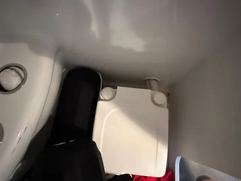 Slide: The Image of Interior view of a 2008 Formula 353 FASTech boat, featuring a compact storage area. - 45