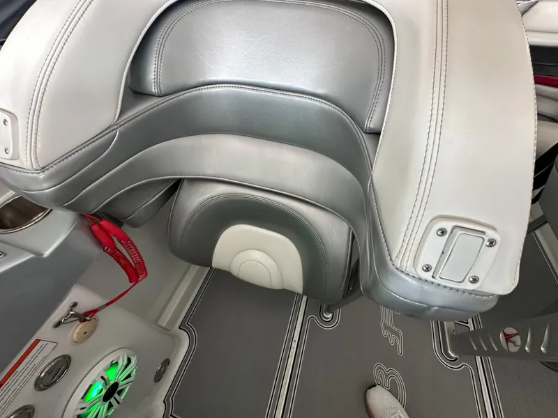 Slide: The Image of 2008 Formula 353 FASTech boat interior with gray leather seating and green-lit speaker. - 48