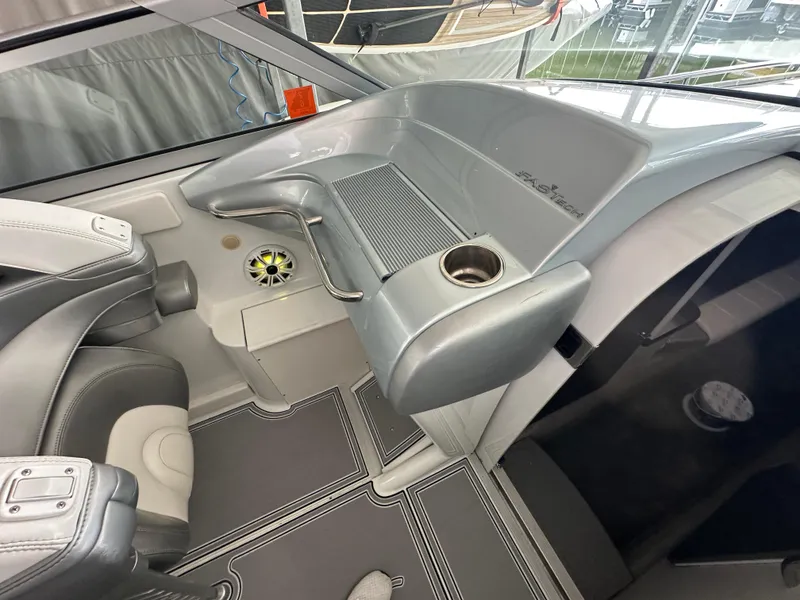 Slide: The Image of 2008 Formula 353 FASTech boat interior with gray seating and cup holder. - 49