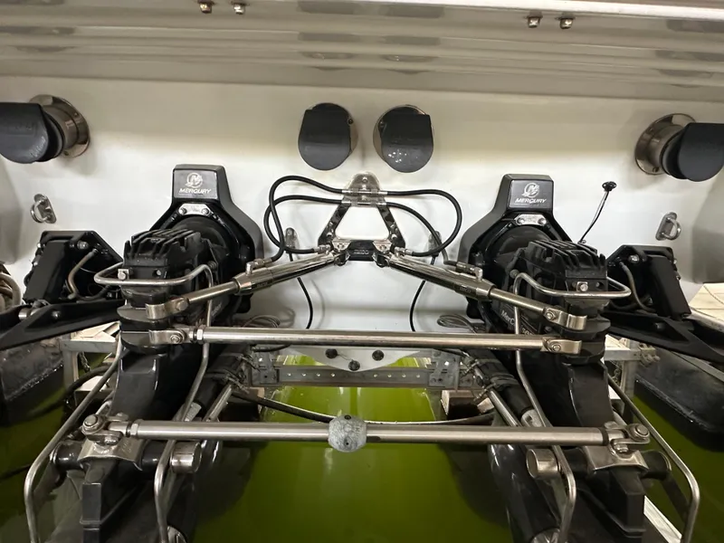 Slide: The Image of Engine compartment of a 2008 Formula 353 FASTech boat, showcasing dual Mercury engines. - 7