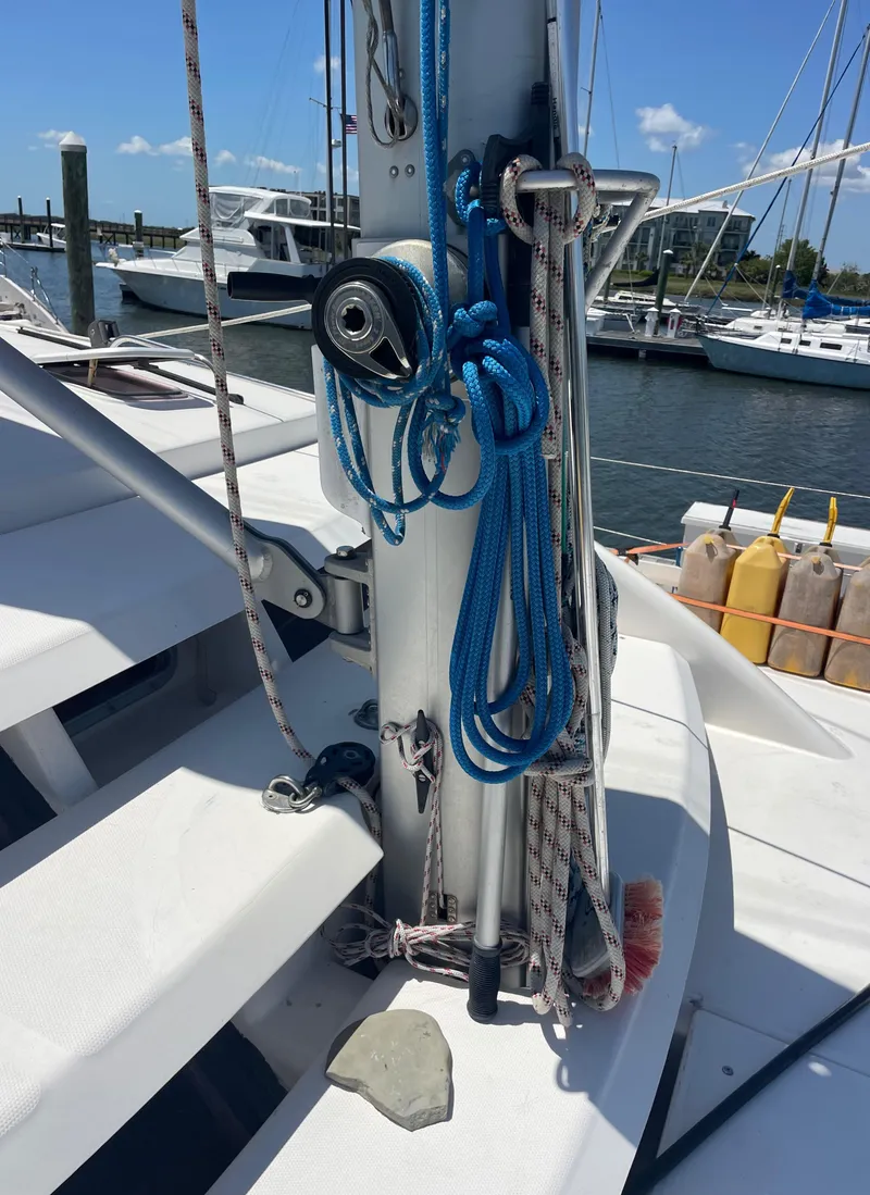 Slide: The Image of Sailboat deck with ropes and pulleys, Leopard 40 model, 2005, docked at marina. - 11