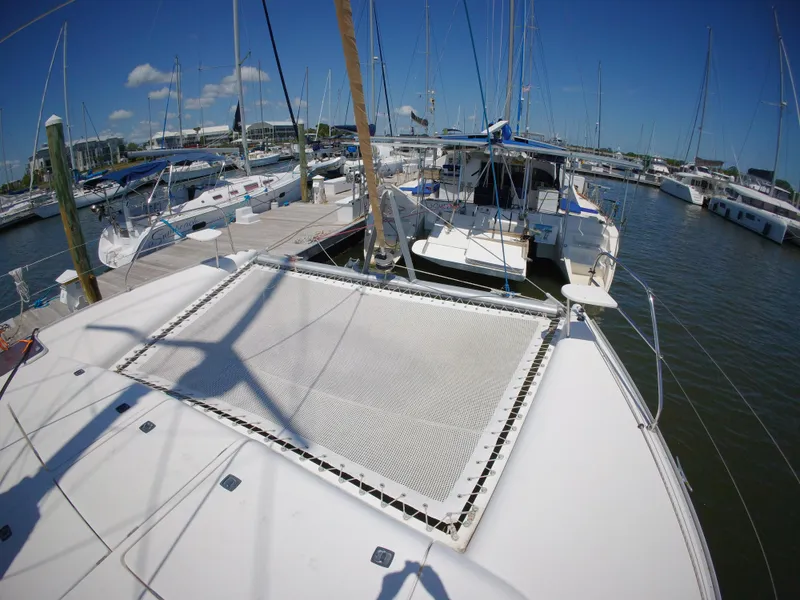 Slide: The Image of 2005 Leopard 40 catamaran docked at marina under clear blue sky. - 17