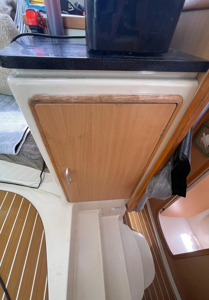Slide: The Image of 2005 Leopard 40 interior with wooden cabinet and countertop. - 36