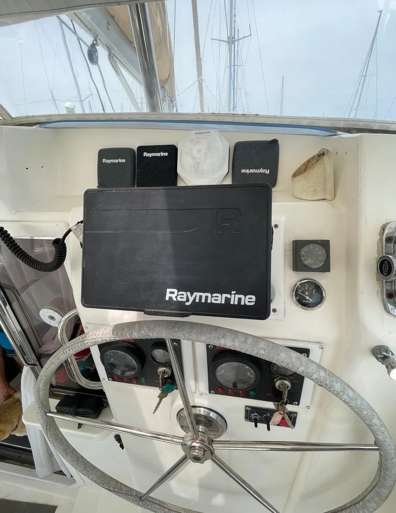 Slide: The Image of Steering wheel and navigation equipment on a 2005 Leopard 40 catamaran. - 9