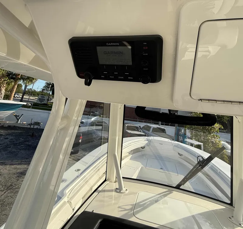 Slide: The Image of 2023 Regulator 34 boat interior with Garmin electronics and spacious deck view. - 16