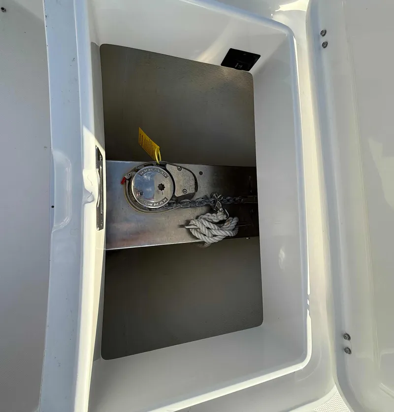 Slide: The Image of 2023 Regulator 34 boat storage compartment with anchor and rope. - 22