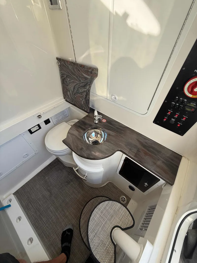 Slide: The Image of 2023 Regulator 34 boat interior with modern bathroom and sleek design. - 24