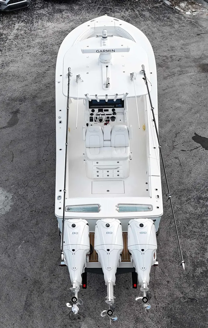 Slide: The Image of 2023 Regulator 34 boat with triple engines, aerial view. - 37