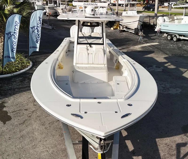 Slide: The Image of 2023 Regulator 34 boat displayed outdoors with Yamaha banners in the background. - 38