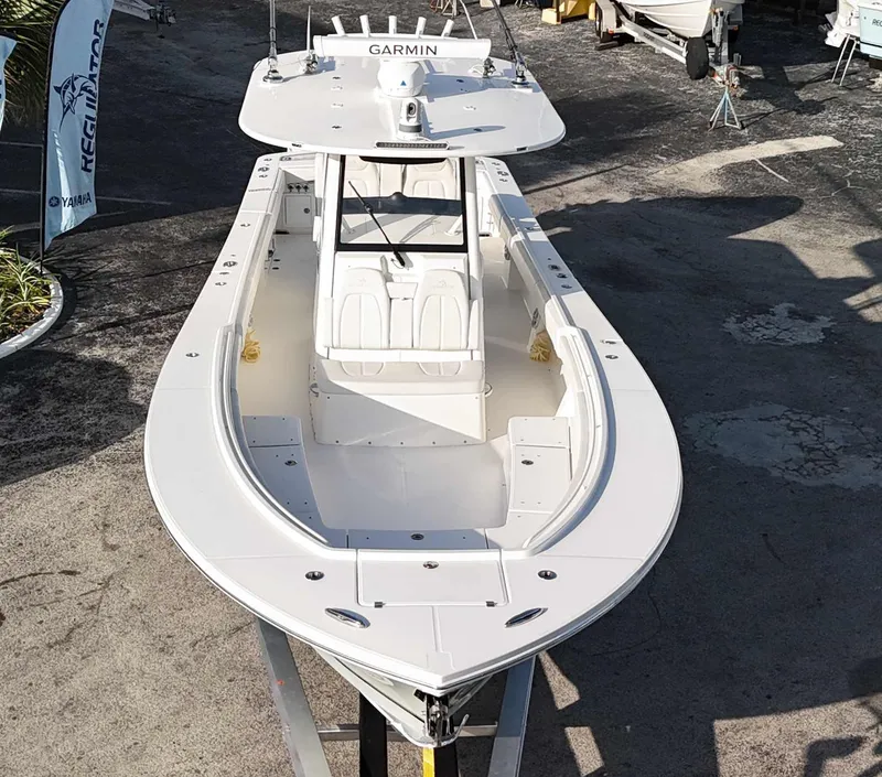 Slide: The Image of 2023 Regulator 34 boat with Garmin equipment, viewed from above in a marina setting. - 39