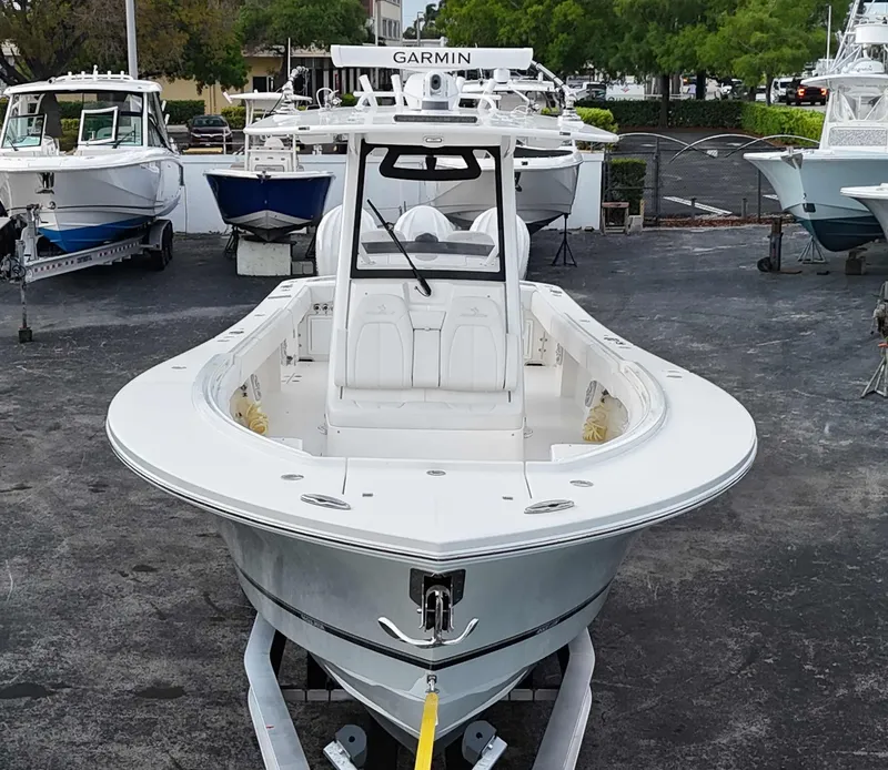 Slide: The Image of 2023 Regulator 34 boat with Garmin equipment, docked in a marina. - 4