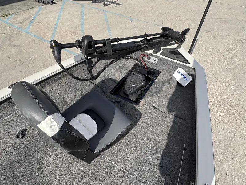 Slide: The Image of 2020 Tracker Pro Team 175 boat interior with seat, trolling motor, and Lowrance device. - 11