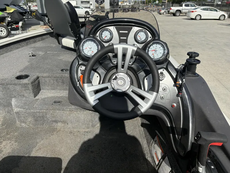 Slide: The Image of 2020 Tracker Pro Team 175 boat dashboard with steering wheel and gauges. - 3