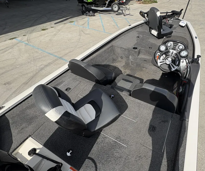 Slide: The Image of 2020 Tracker Pro Team 175 boat interior with steering console and seating. - 8