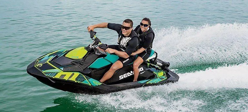 Slide: The Image of Two people riding a 2019 Sea-Doo Spark 2up 900 H.O. ACE on the water. - 10