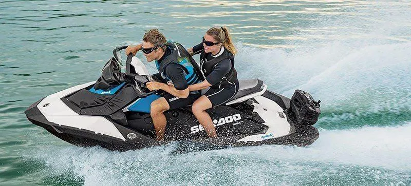 Slide: The Image of 2019 Sea-Doo Spark 2up 900 H.O. ACE jet ski with two riders on water. - 14