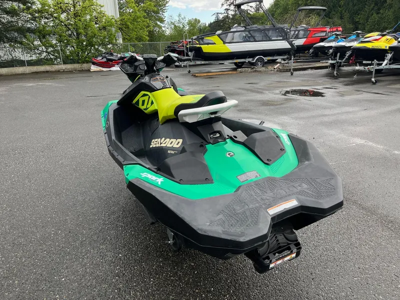 Slide: The Image of 2019 Sea-Doo Spark 2up 900 H.O. ACE jet ski in a parking lot. - 6