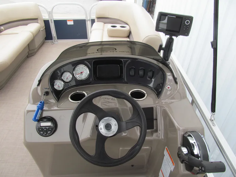 Slide: The Image of 2020 Sun Tracker Party Barge 18 DLX dashboard with steering wheel and gauges. - 5