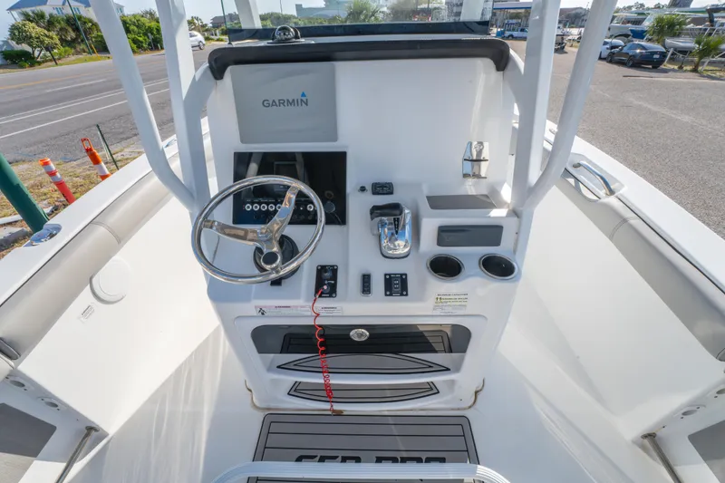 Slide: The Image of 2019 Sea Pro 239 DLX boat console with Garmin navigation system and steering wheel. - 16
